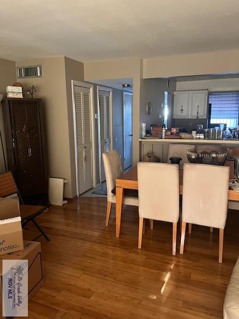 401 Boca Chica Blvd Unit 110, Brownsville, TX 78520 - dining room featuring wood finished floors