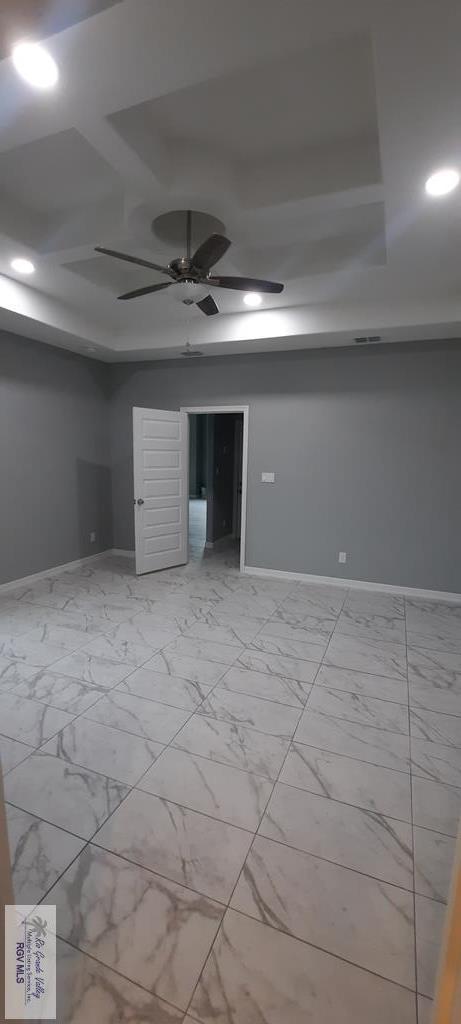 unfurnished room featuring ceiling fan