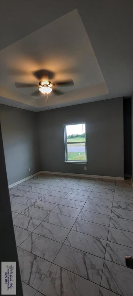 spare room with ceiling fan