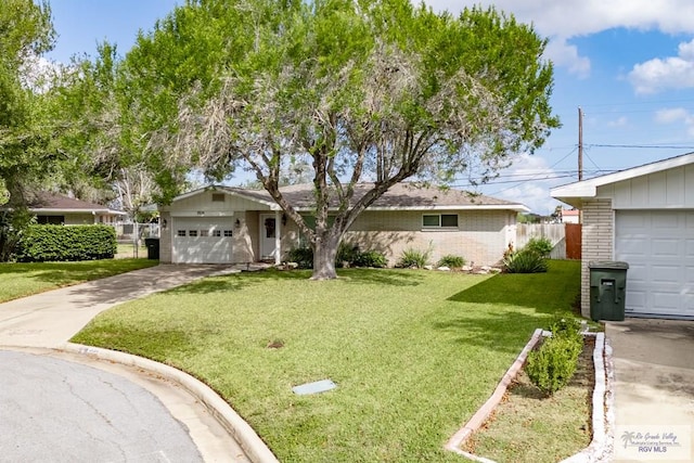 single story home featuring a garage and a front yard