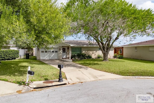 ranch-style home with a garage and a front yard