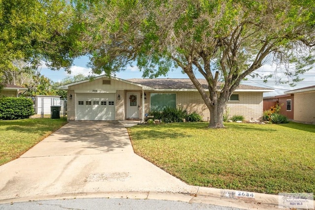 view of front of home with a front lawn and a garage