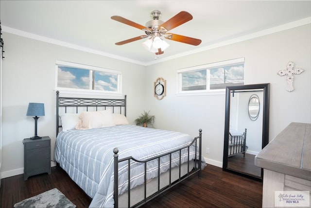 bedroom featuring ceiling fan, crown molding, and dark wood-type flooring