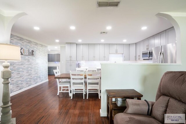 dining area with dark hardwood / wood-style floors