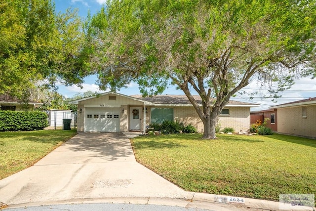 view of front facade with a garage and a front lawn