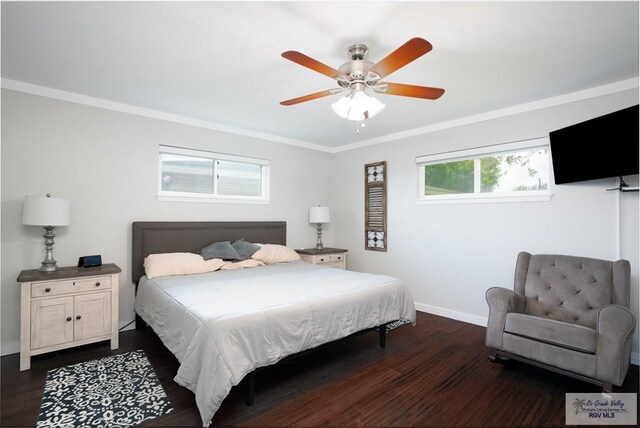 bedroom featuring ceiling fan, dark hardwood / wood-style floors, crown molding, and multiple windows