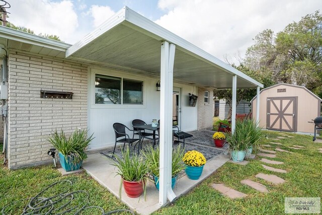 view of patio / terrace featuring a storage unit