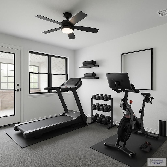 workout room with visible vents, a ceiling fan, baseboards, and carpet flooring