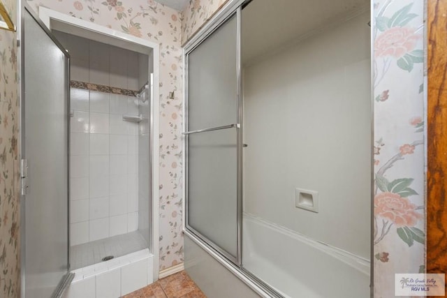 bathroom featuring wallpapered walls, enclosed tub / shower combo, and tile patterned floors