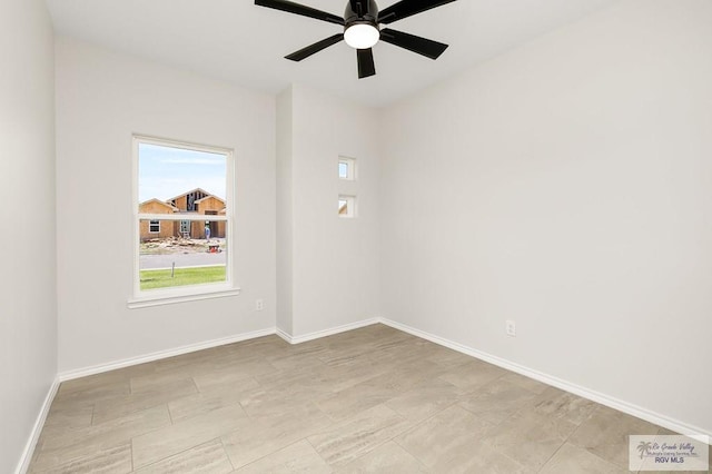 324 N Leon Ave, Elsa, TX 78543 - unfurnished room featuring a ceiling fan and baseboards