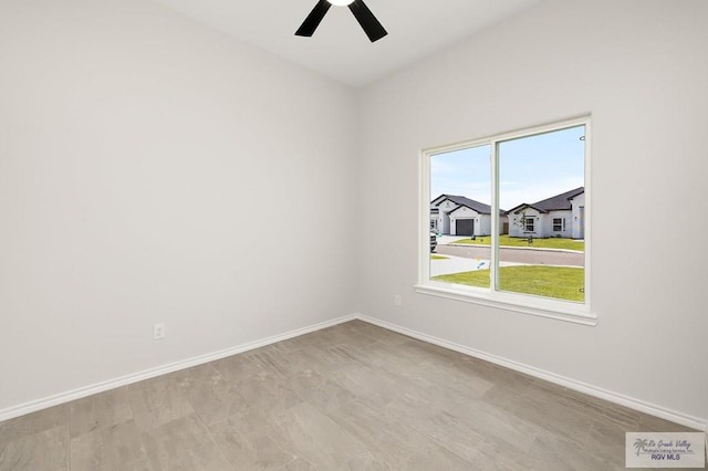 324 N Leon Ave, Elsa, TX 78543 - unfurnished room with baseboards and ceiling fan
