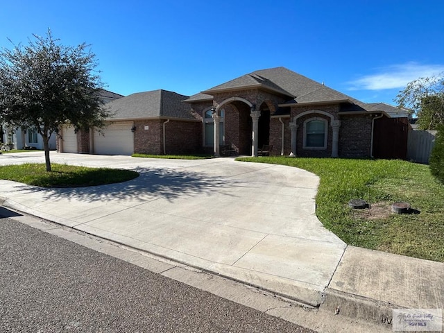 single story home with a front lawn and a garage