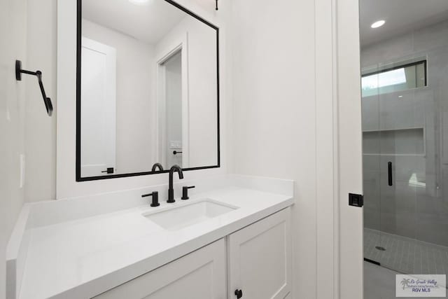 bathroom with vanity and walk in shower