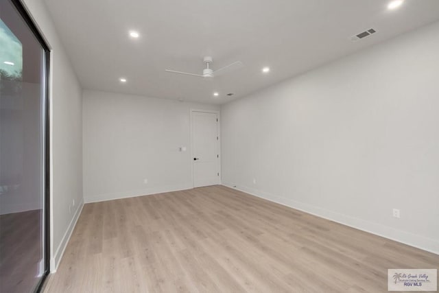 spare room with ceiling fan and light hardwood / wood-style flooring