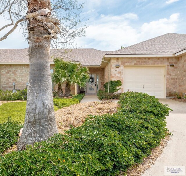 single story home featuring a garage