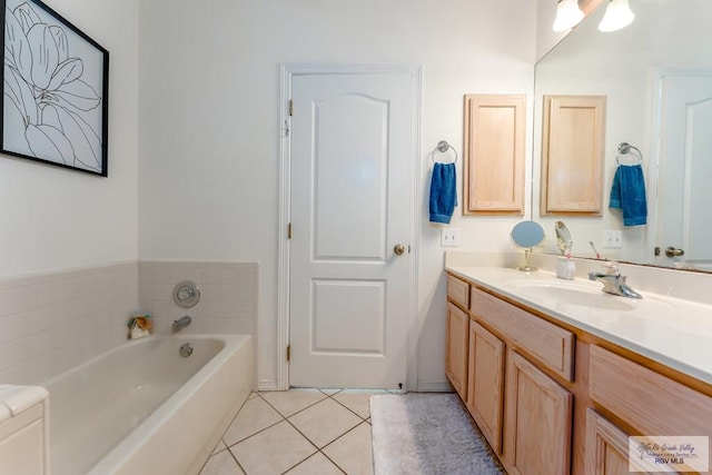 bathroom with vanity, a tub to relax in, and tile patterned floors