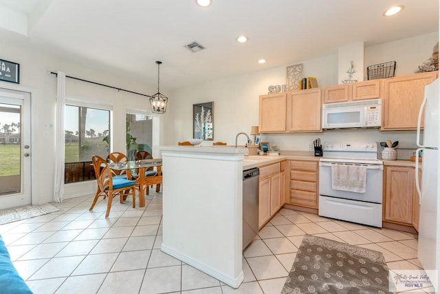 kitchen featuring pendant lighting, light brown cabinets, and white appliances