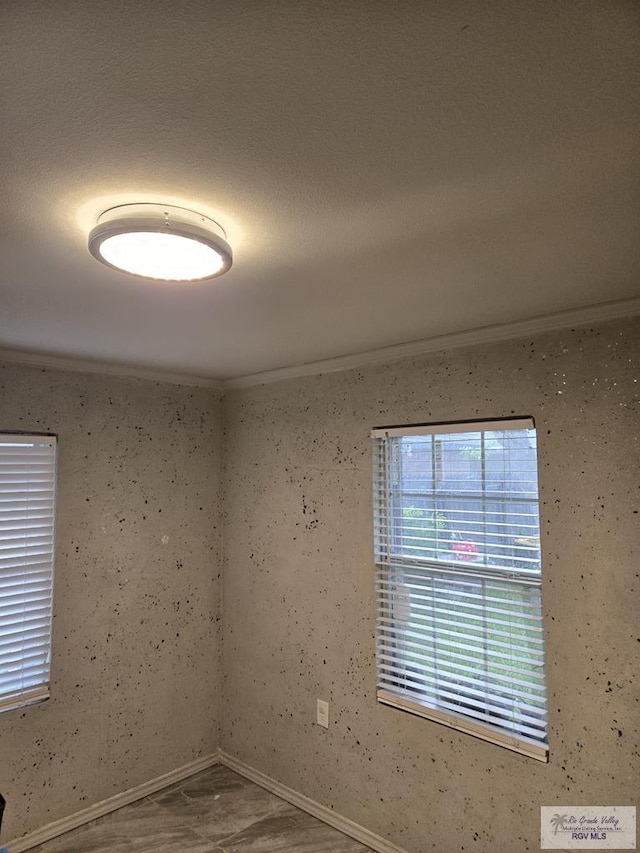 384 Colorado Dr, San Benito, TX 78586 - unfurnished room with crown molding and baseboards