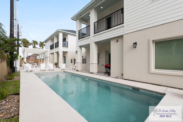 115 Marlin St Unit C, South Padre Island, TX 78597 - outdoor pool featuring a patio area
