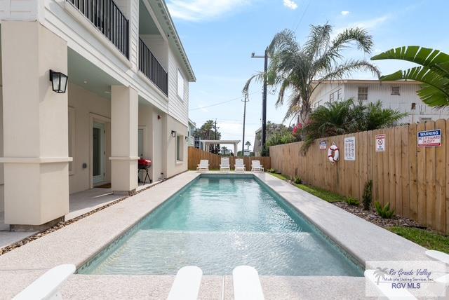 115 Marlin St Unit C, South Padre Island, TX 78597 - view of pool featuring a fenced backyard