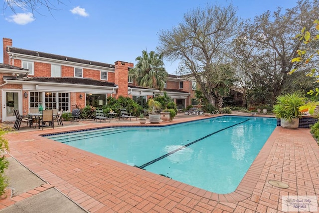 2301 Riverside Dr, Harlingen, TX 78550 - outdoor pool featuring outdoor dining area and a patio area