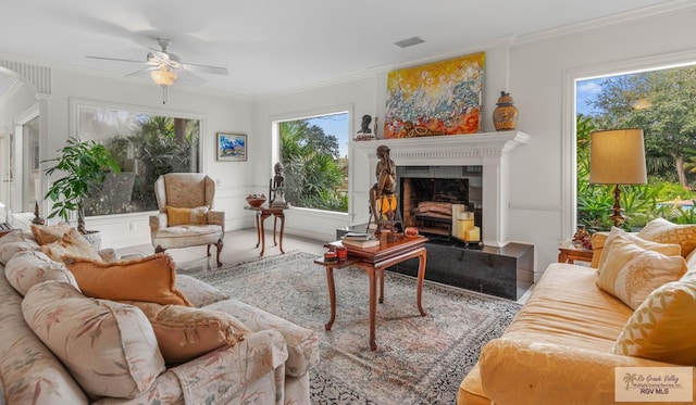 2301 Riverside Dr, Harlingen, TX 78550 - interior space with a ceiling fan, a healthy amount of sunlight, a fireplace with raised hearth, and visible vents
