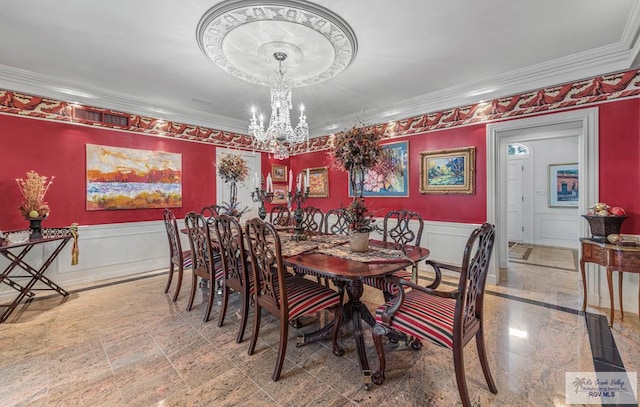2301 Riverside Dr, Harlingen, TX 78550 - dining area with an inviting chandelier, ornamental molding, a decorative wall, and wainscoting