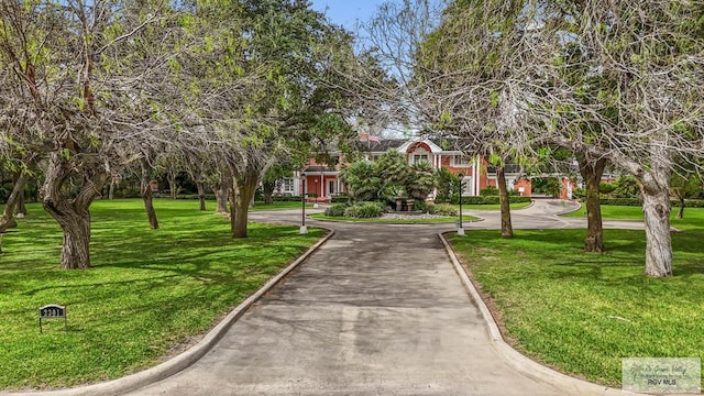 2301 Riverside Dr, Harlingen, TX 78550 - view of home's community with a yard