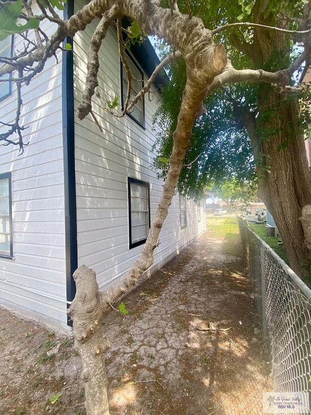 view of home's exterior featuring fence