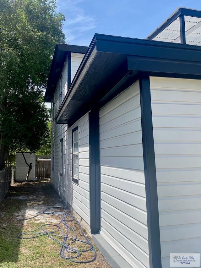 view of property exterior with fence