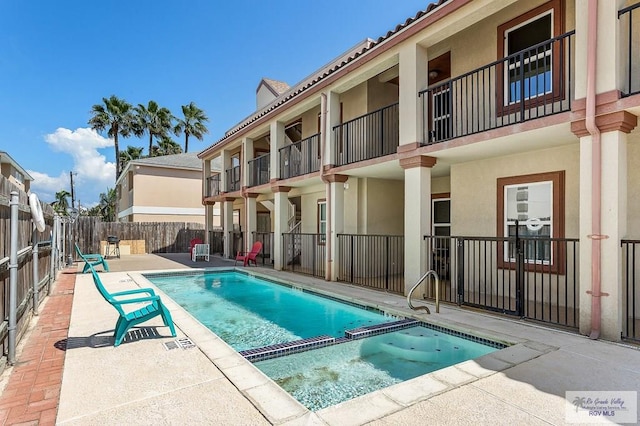 view of swimming pool featuring a patio