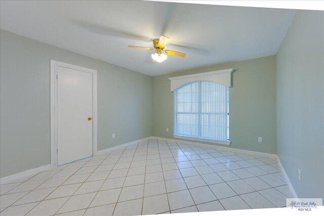 1544 W San Marcelo Blvd, Brownsville, TX 78526 - empty room with light tile patterned floors, baseboards, and a ceiling fan
