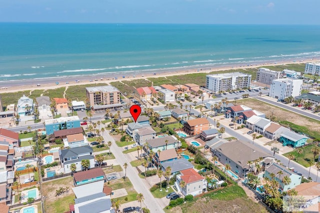 aerial view with a water view and a view of the beach