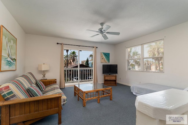 living room featuring carpet flooring, plenty of natural light, and ceiling fan