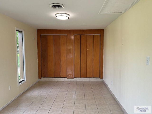 2301 E Monroe St, Harlingen, TX 78550 - hallway featuring light tile patterned floors and baseboards