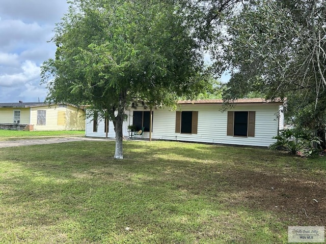 2301 E Monroe St, Harlingen, TX 78550 - ranch-style home featuring a front yard