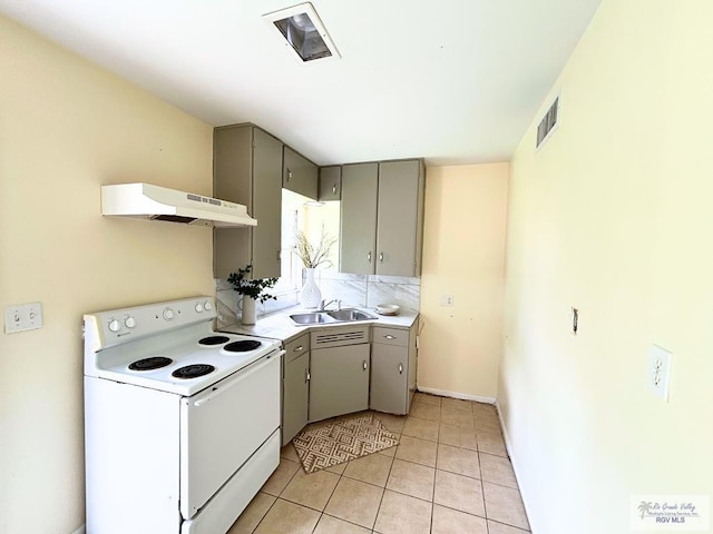 2301 E Monroe St, Harlingen, TX 78550 - kitchen featuring white electric range oven, under cabinet range hood, gray cabinetry, and light tile patterned floors