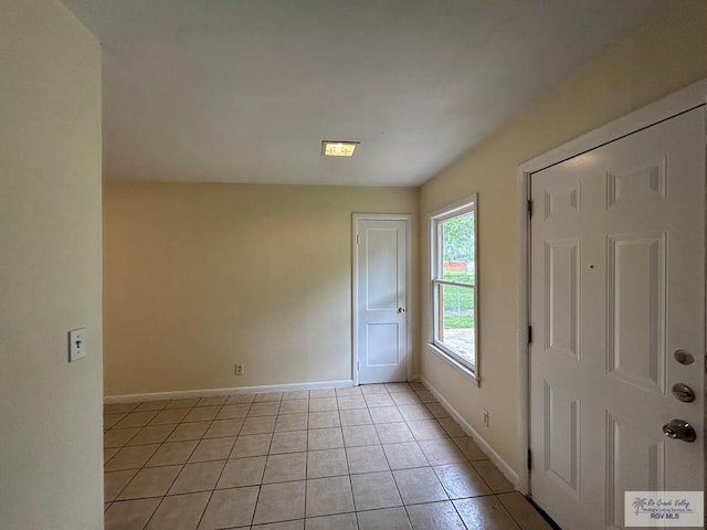 2301 E Monroe St, Harlingen, TX 78550 - entrance foyer with light tile patterned floors and baseboards