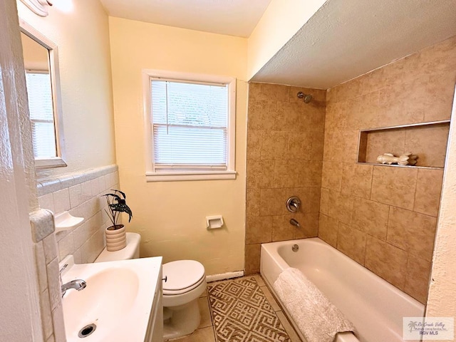 2301 E Monroe St, Harlingen, TX 78550 - bathroom featuring tile patterned floors, shower / bathtub combination, and vanity