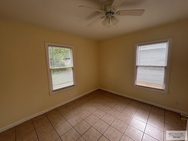 2301 E Monroe St, Harlingen, TX 78550 - spare room with ceiling fan and light tile patterned floors