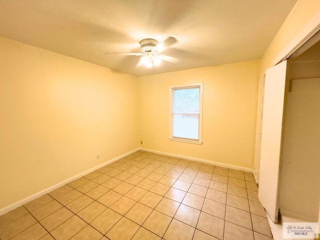 2301 E Monroe St, Harlingen, TX 78550 - unfurnished bedroom featuring light tile patterned flooring, a closet, and ceiling fan