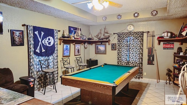 playroom with tile patterned flooring, billiards, ceiling fan, and a textured ceiling
