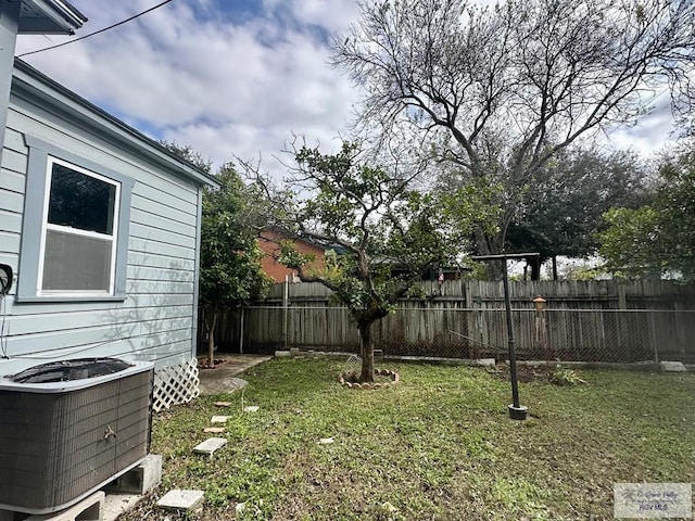 view of yard featuring central air condition unit