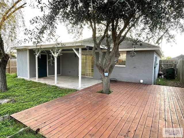 rear view of house with a yard and a patio