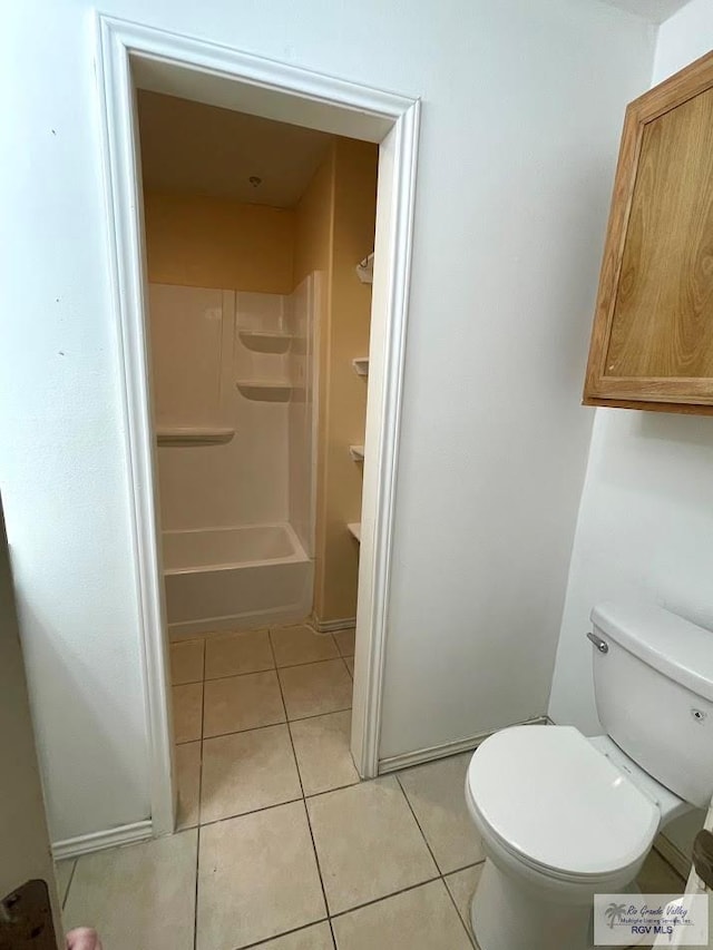 bathroom with tile patterned flooring and toilet