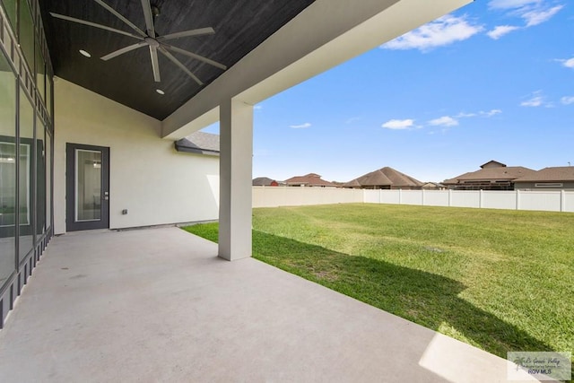 view of patio with fence and ceiling fan