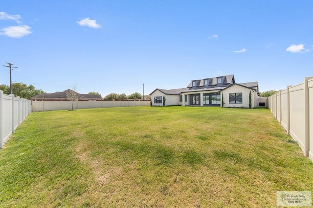 view of yard featuring a fenced backyard