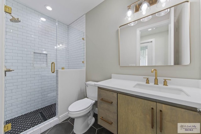 full bathroom with tile patterned flooring, vanity, toilet, and a stall shower