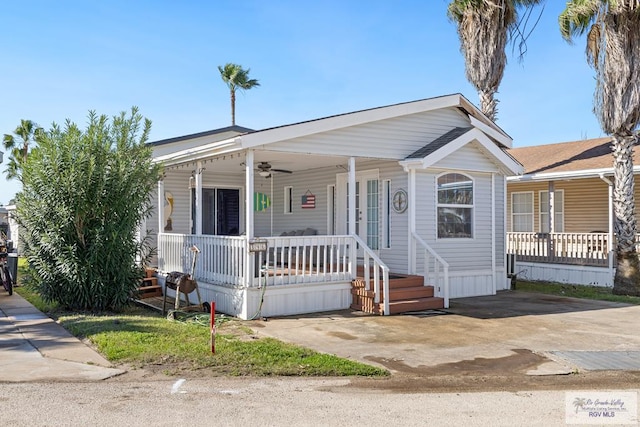 manufactured / mobile home featuring a porch, french doors, and a ceiling fan