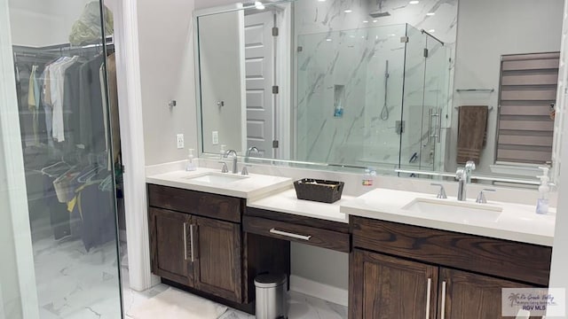 bathroom with vanity and a shower with door